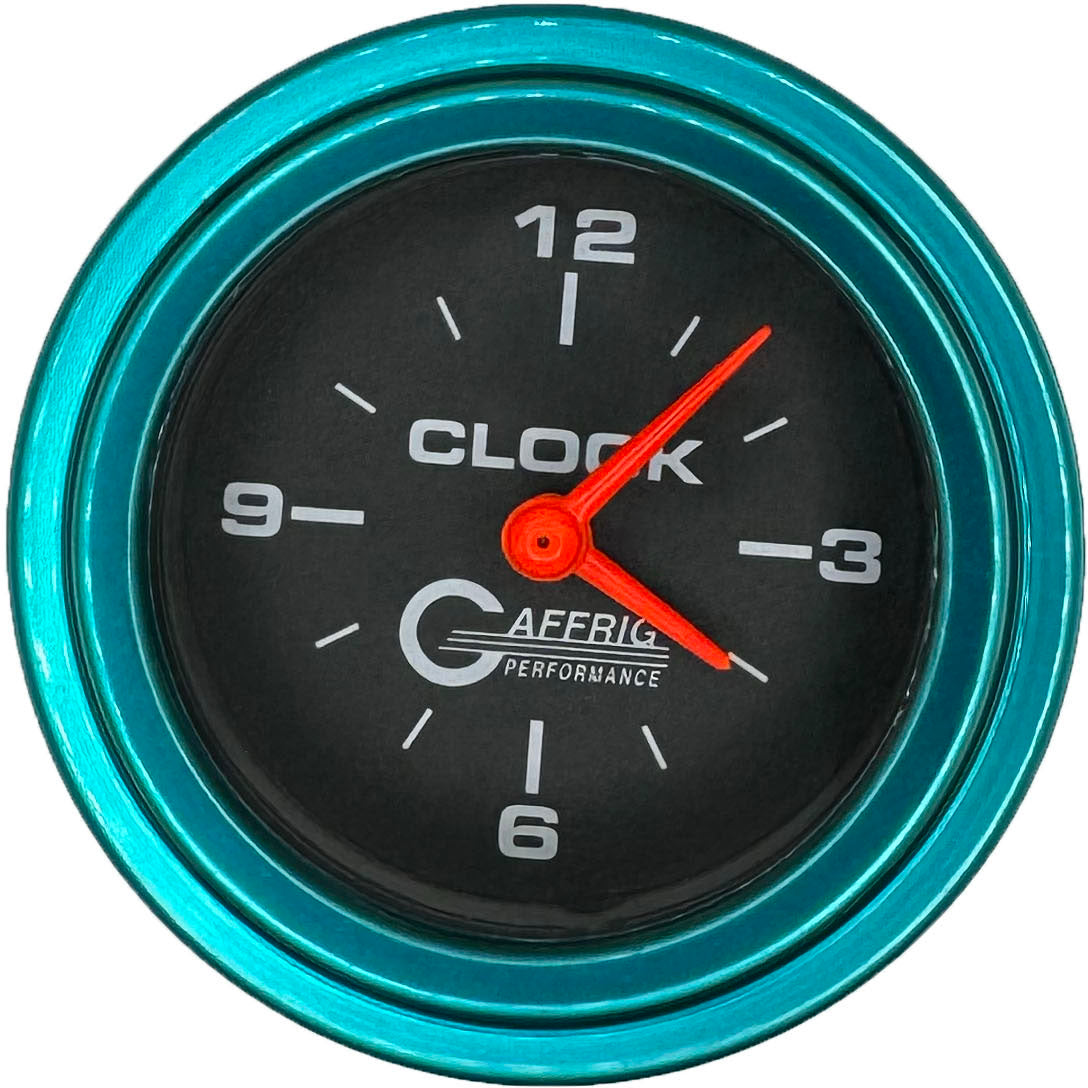 GAFFRIG PART #5054 2 INCH ELECTRIC CLOCK GAUGE BLACK TEAL / STEP RIM